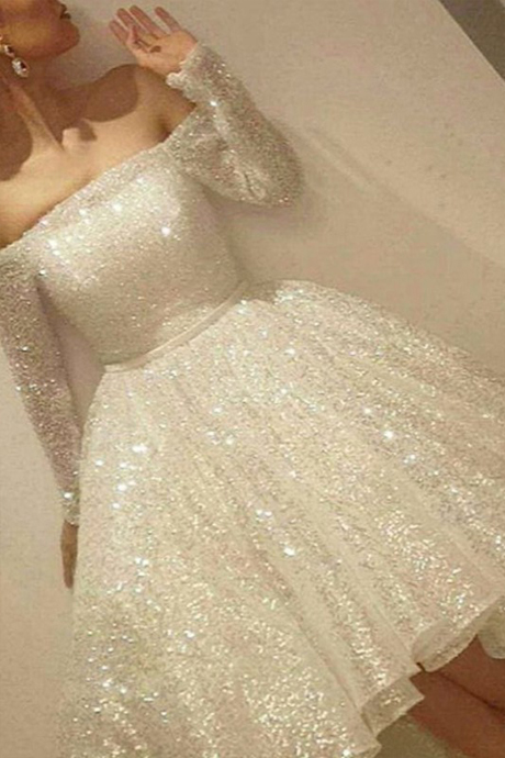 white sequin gown with sleeves